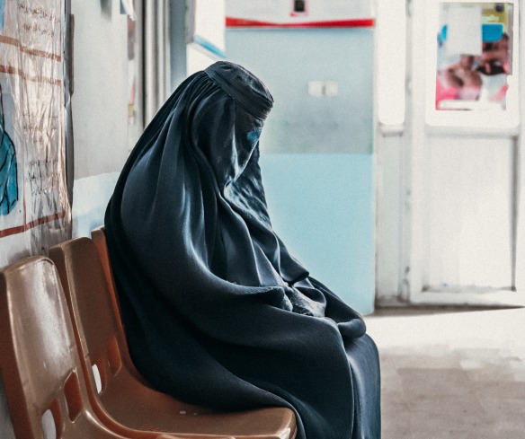 A mother in the waiting room at a health clinic in Parwan province.