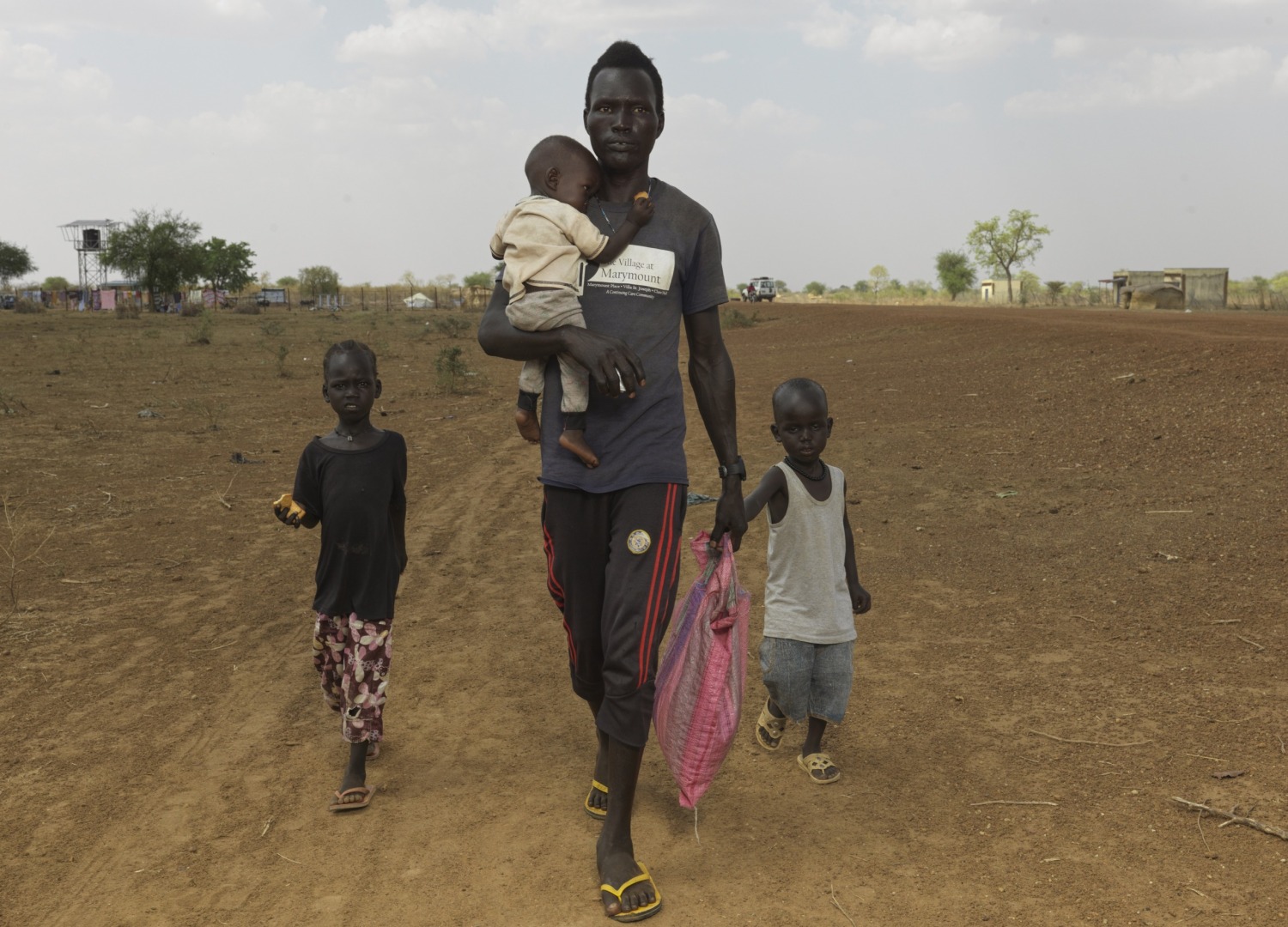 Dhieng Bol Deng and his family arrive from war torn Sudan with the only belongings they could salvage. Action Against Hunger will now provide them with screening for malnutrition and high energy biscuits.