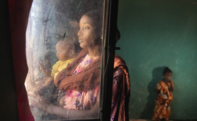 Darmi and her daughters inside their home.