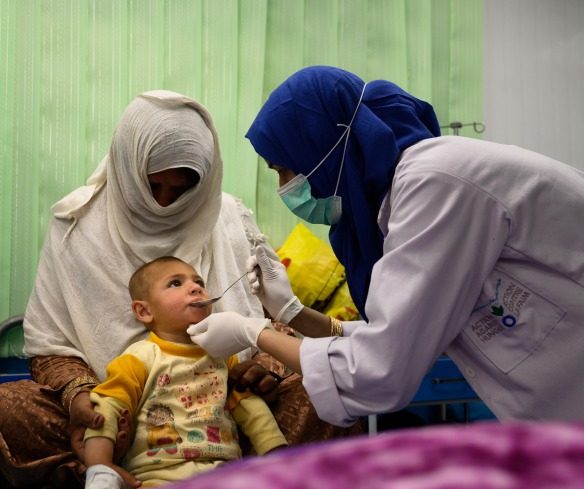 A nurse treats a two-year-old boy suffering from malnutrition and pneumonia at an Action Against Hunger Therapeutic Feeding Unit in Kabul, Afghanistan.