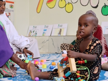 Caregivers and children connect at the stabilization center's play area.