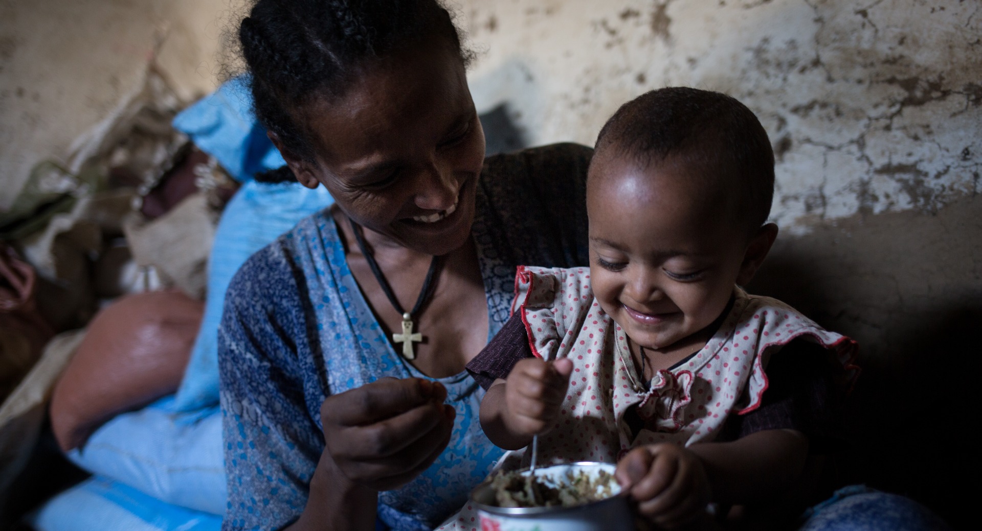 Shewagu with her two-year-old daughter.