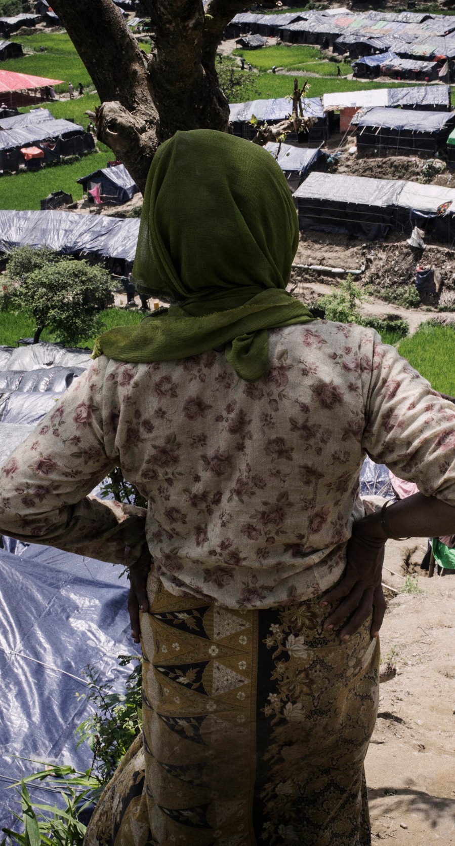 A Rohingya woman looks out over the camps in Cox's Bazar.