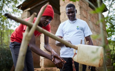 Action Against Hunger teams carry out sensitization activities with families to teach about good hygiene and encourage use of latrines.