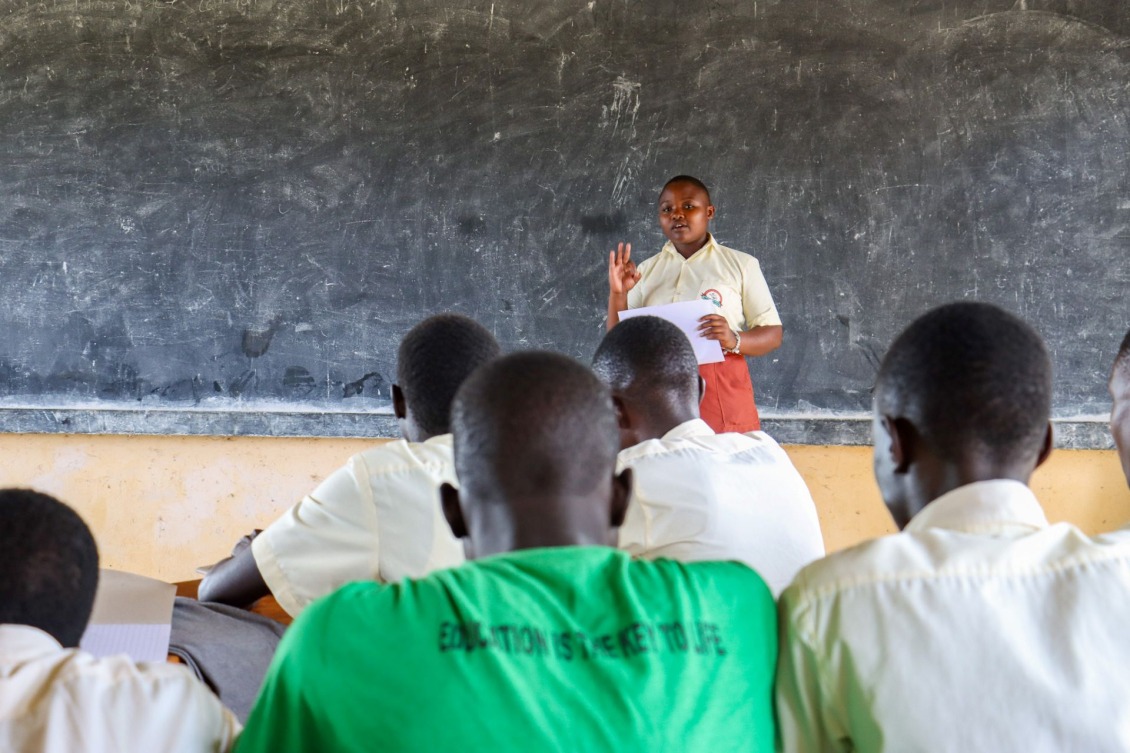 Patience Namuju training members of the school’s health & nutrition club on food choices.