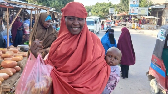 Maryan buys food with emergency cash.