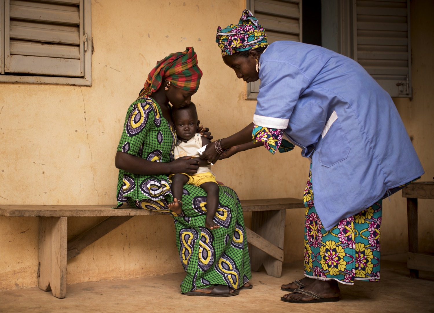 Naré Tounkara, matron of the Boudofo Community Health Center in Kita, Mali, measures a child for malnutrition.