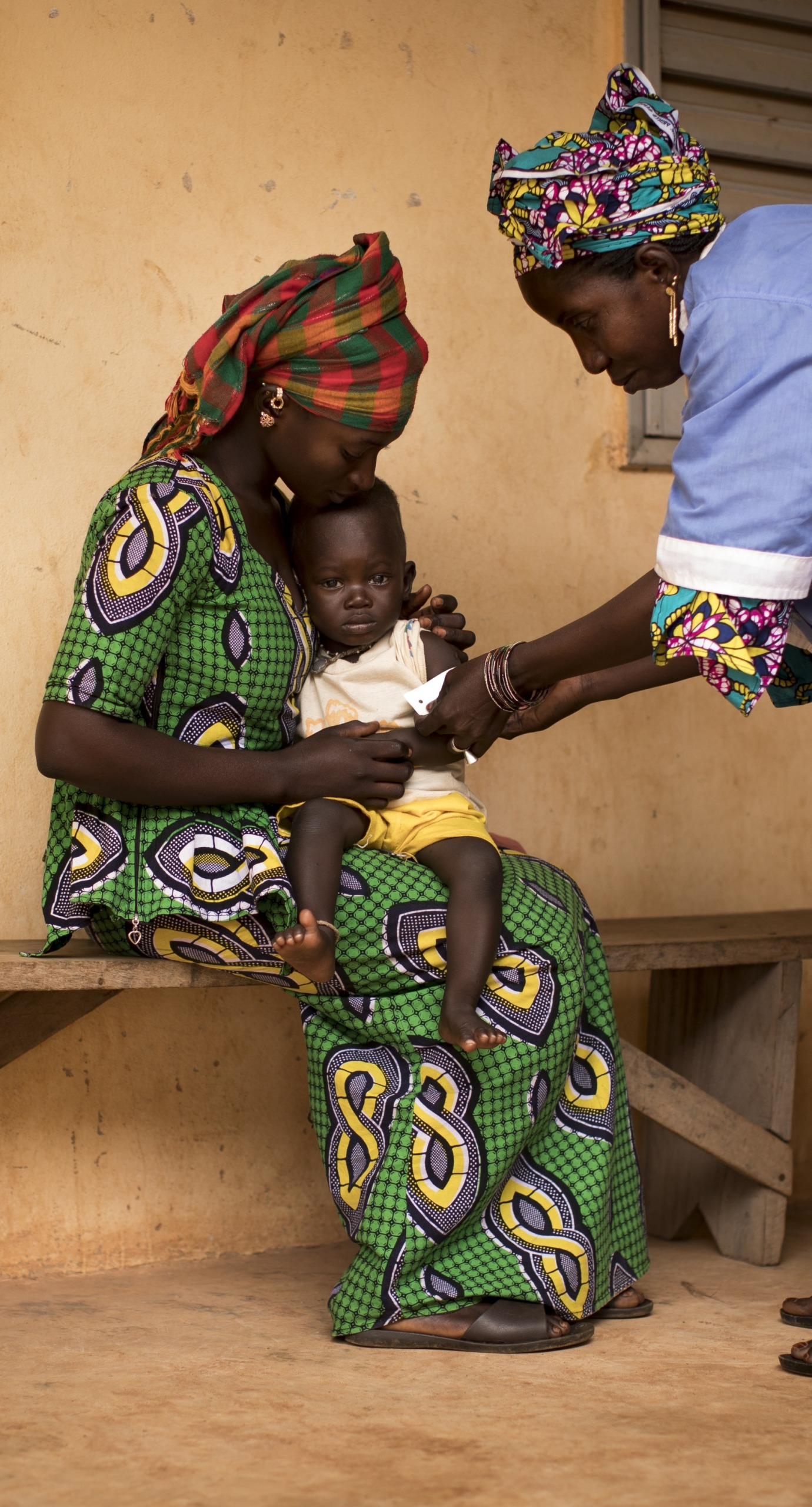 Naré Tounkara, matron of the Boudofo Community Health Center in Kita, Mali, measures a child for malnutrition.