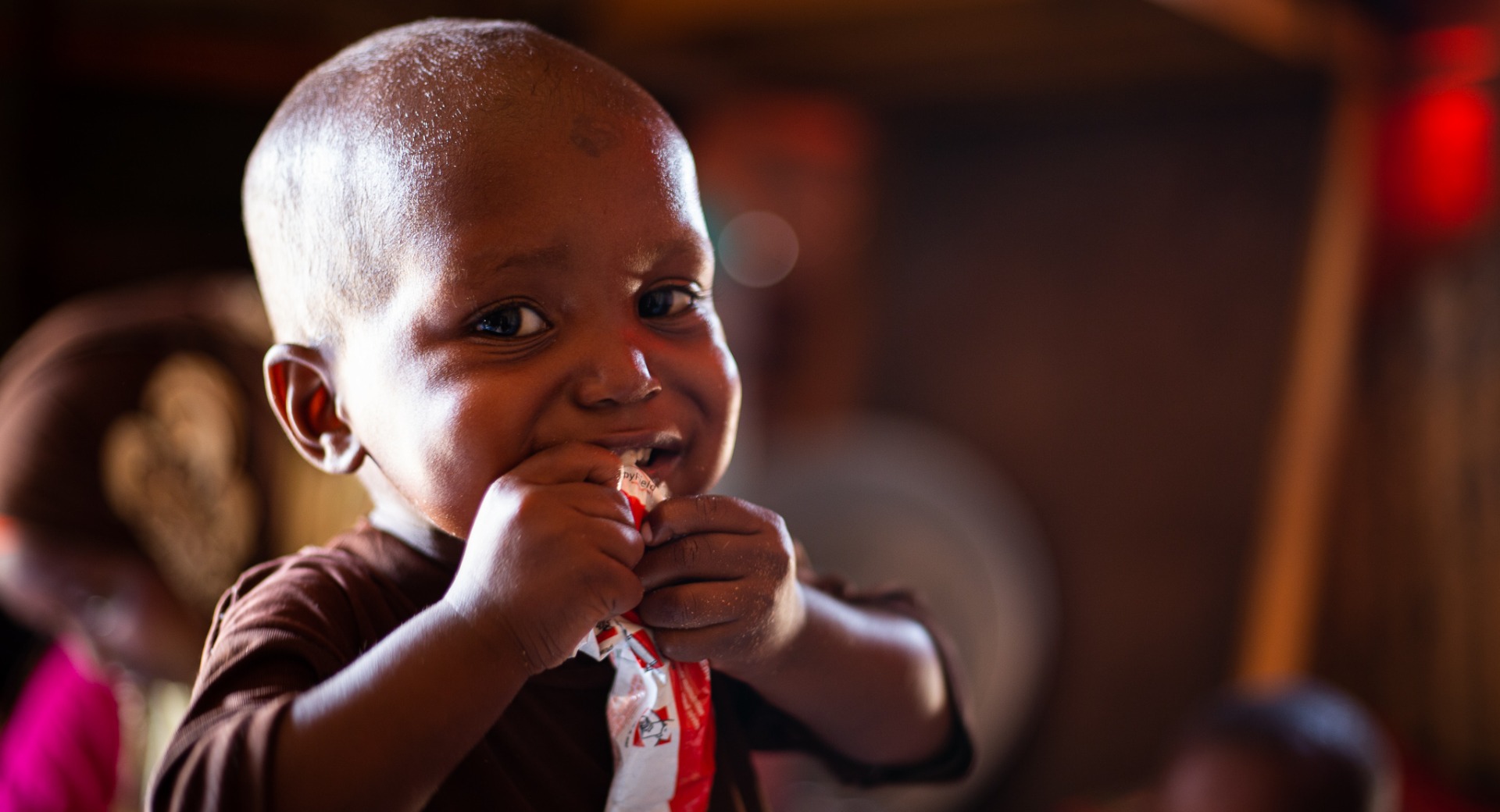 A young boy eating food