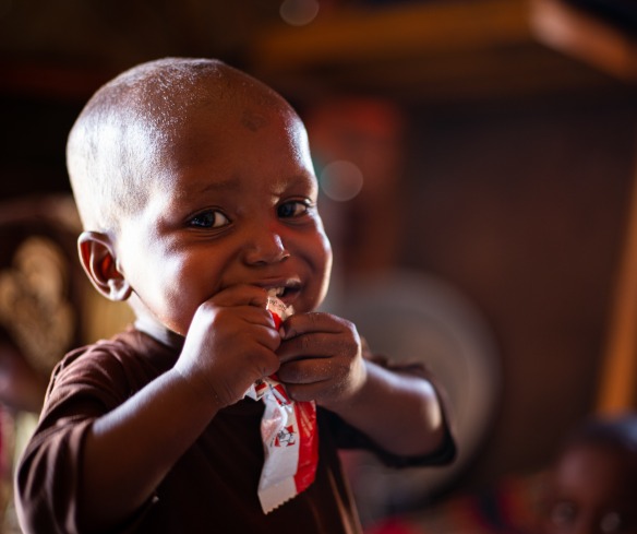 A young boy eating food