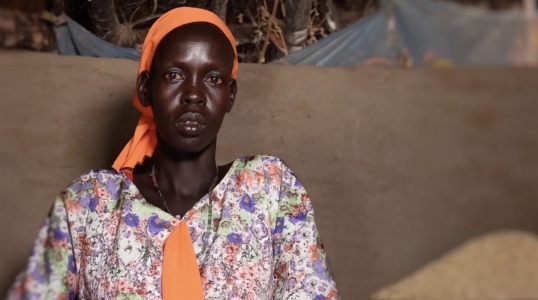A woman looking into camera in South Sudan