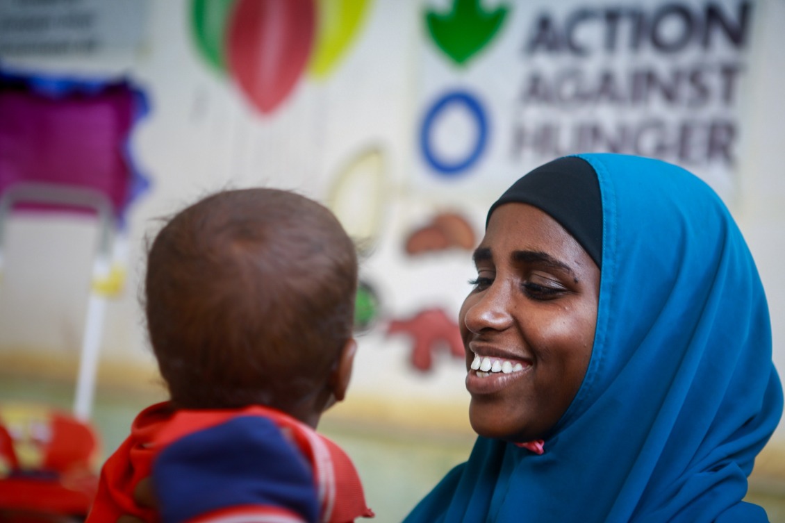 A mother and baby in the play area of a stabilization center.