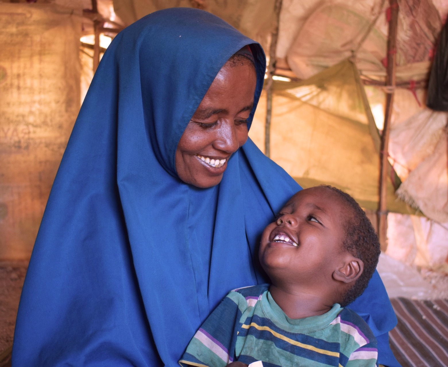 A happy mother and child look at each other