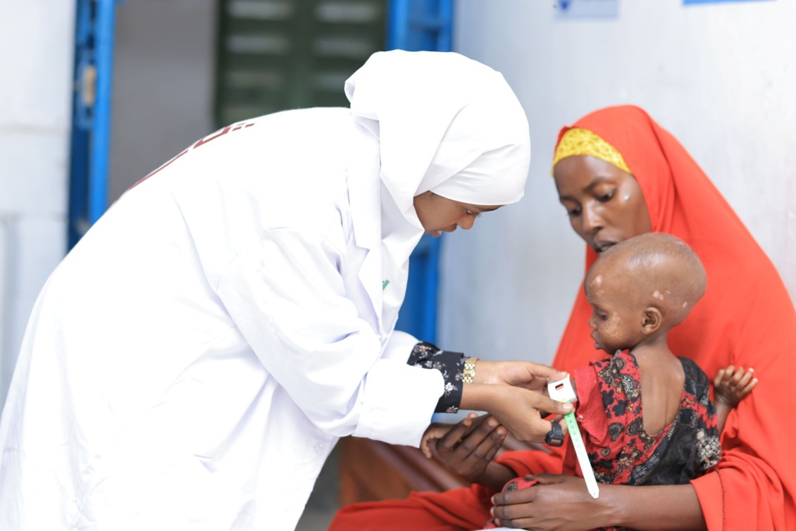 A child receives care at an Action Against Hunger in-patient facility in Somalia.