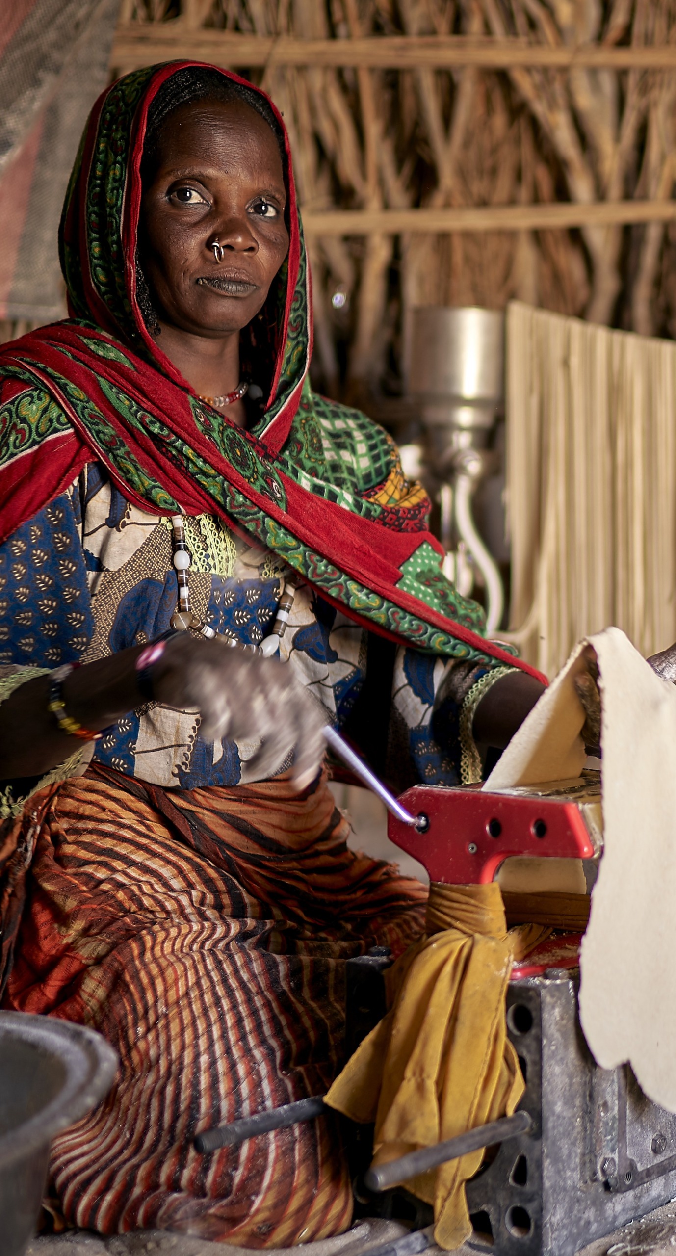 A woman makes pasta inside her home.
