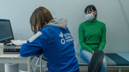 Oksana, 42, local resident of Andriivka on the breast checkup of ACF mobile unit in the local clinic in Andriivka village, Kharkiv region, Ukraine on 8 December 2025
