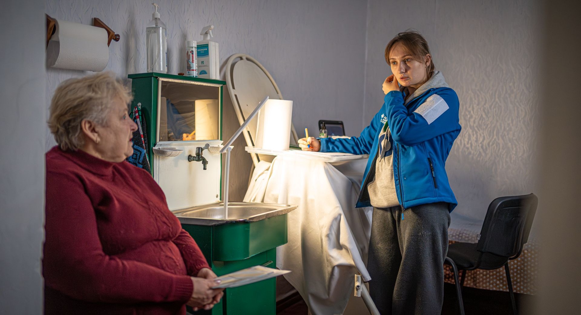 Olha Panasenko, 60, local resident of Kurmany village on the breast checkup of ACF mobile unit and Anastasia, 27, obstetrician-gynecologist of ACF mobile unit in the local clinic in Kurmany village, Sumy region
