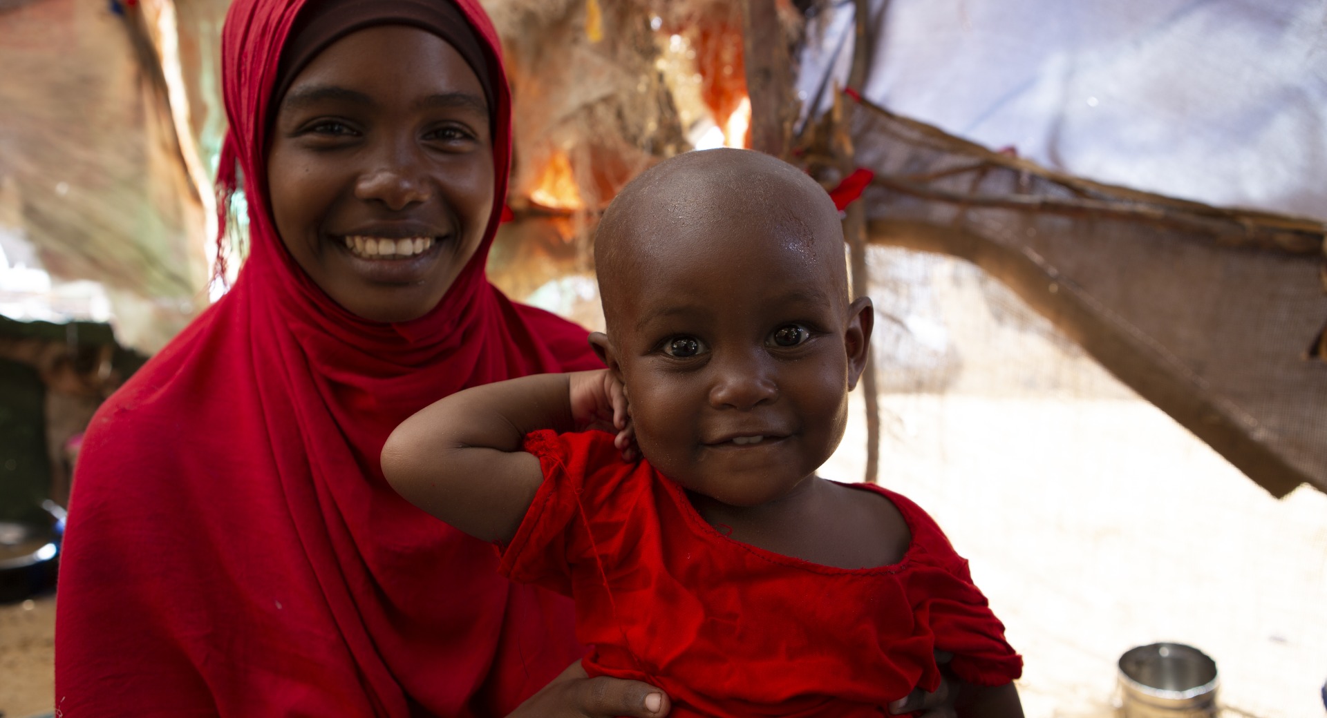 Fatuma and Halima at home. The family lives with Fatuma's uncle in a displacement camp outside of Mogadishu, Somalia.